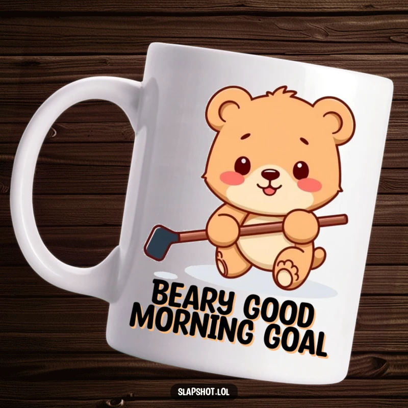 Funny mug featuring a happy bear cub with a miniature hockey stick, playfully batting a puck on the ice, full of charm.