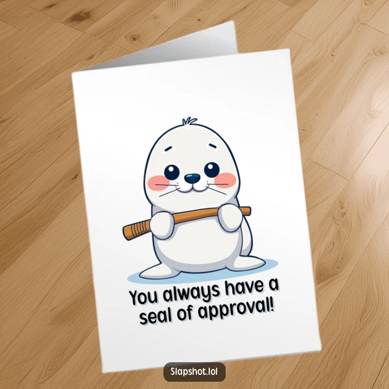 Funny Free Printable Congratulations Card: A playful seal balances a hockey stick on its nose, cheering for success.