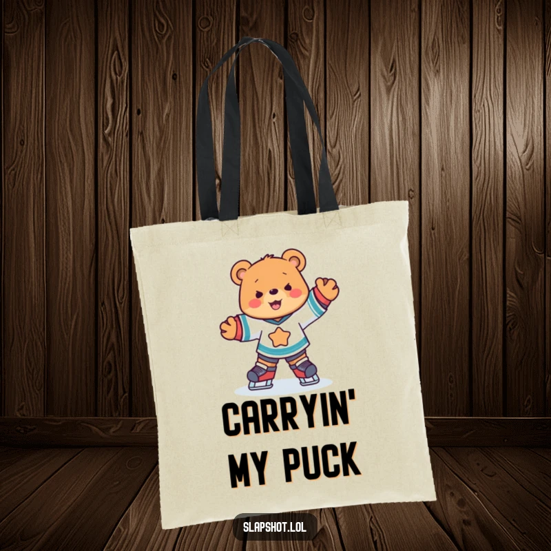 Funny cute bear wearing hockey jersey skates joyfully on a durable and stylish tote bag.